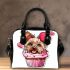 Cute pink yorkshire terrier in a cupcake shoulder handbag