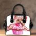 Cute pink yorkshire terrier in a cupcake shoulder handbag