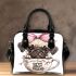 Cute pug puppy with a pink bow on its head shoulder handbag