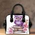 Cute purple owl sitting on top of books surrounded by pink roses shoulder handbag