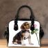 Cute valentine's day beagle puppy holding a pink rose shoulder handbag