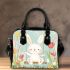 Cute white rabbit sitting on the swing shoulder handbag