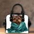 Cute yorkshire terrier wrapped in teal blanket shoulder handbag