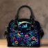 Glowing butterflies dance among vibrant flowers shoulder handbag