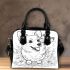 Happy corgi with butterfly on its nose in the garden shoulder handbag