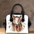 Indian horse with white feathers in its mane shoulder handbag