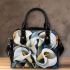 Painting of calla lilies in bold geometric shapes shoulder handbag