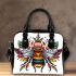 Queen bee with a crown sitting on flower shoulder handbag