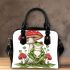 Red and white mushroom with green frog sitting on it shoulder handbag