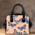 Seamless pattern with a digital illustration of blue butterflies shoulder handbag