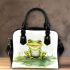 Smiling frog sitting on a pond shoulder handbag