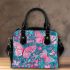 Vibrant pattern of pink and turquoise butterflies shoulder handbag