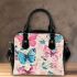 Vibrant pattern of pink and turquoise butterflies shoulder handbag