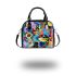 Abstract composition of circular shapes and lines shoulder handbag