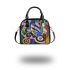 Abstract composition of circular shapes and lines shoulder handbag