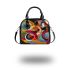 Abstract composition with geometric shapes and vibrant colors shoulder handbag