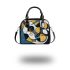 Abstract painting of guitar shapes and lines in blues shoulder handbag