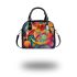 Abstract painting of vibrant colors and shapes shoulder handbag