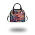 An intricate colorful painting shoulder handbag