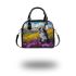 Black and white border collie sits in the foreground of an oil painting shoulder handbag