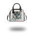 Black and white owl with teal highlights shoulder handbag