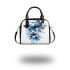 Blue butterfly with white flowers around shoulder handbag