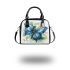 Blue butterfly with white flowers around shoulder handbag