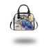 Blue macaw in the style of watercolor and ink shoulder handbag