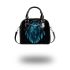 Blue owl sitting on dream catcher shoulder handbag