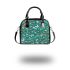 Butterflies and flowers scattered across shoulder handbag