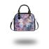 Colored butterfly surrounded by blooming flowers shoulder handbag