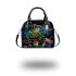 Colorful green frog playing banjo under mushroom shoulder handbag