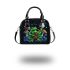 Colorful green frog playing banjo under mushroom shoulder handbag