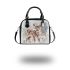 Cute baby deer in the snow shoulder handbag