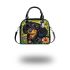 Cute black and tan dachshund among spring flowers with butterflies shoulder handbag