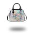 Cute butterfly surrounded by pastel flowers shoulder handbag