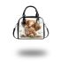 Cute cartoon puppy sits on the ground with its paws spread shoulder handbag