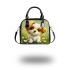 Cute cartoon puppy sitting on the grass shoulder handbag