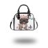Cute grey french bulldog dog wearing a pink flower shoulder handbag
