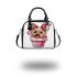Cute pink yorkshire terrier in a cupcake shoulder handbag
