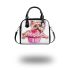 Cute pink yorkshire terrier in a cupcake shoulder handbag