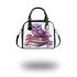 Cute purple owl sitting on top of books surrounded shoulder handbag