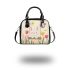 Cute white bunny surrounded by colorful tulips shoulder handbag