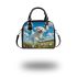 Cute white puppy running in a flower field shoulder handbag