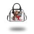 Cute yorkshire terrier inside shoulder handbag