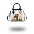 Deer with large antlers stands in the forest shoulder handbag