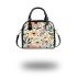 Featuring pastel flowers and bees shoulder handbag
