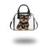 Frontal picture of a cute yorkshire terrier puppy shoulder handbag
