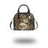 Green frog playing the banjo on top of human skull shoulder handbag