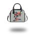 Koi fish with butterfly wings is depicted shoulder handbag